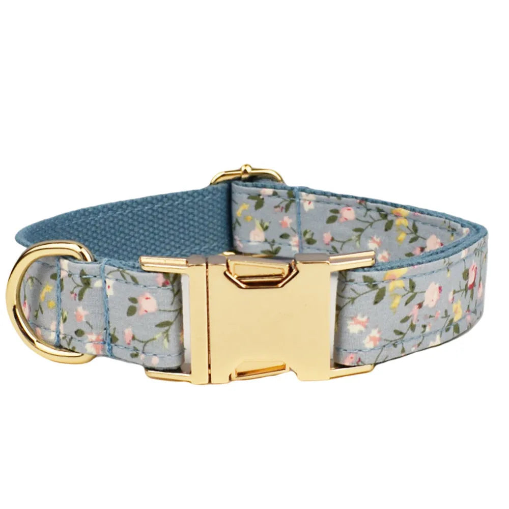 Blue floral pattern dog collar set with adjustable sizing and multiple accessory pieces