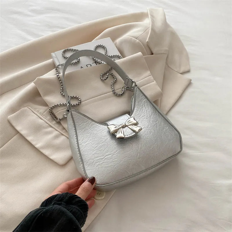 PU dumpling underarm bag with one-shoulder strap, sandwich pocket, sewing thread detail, shown in black