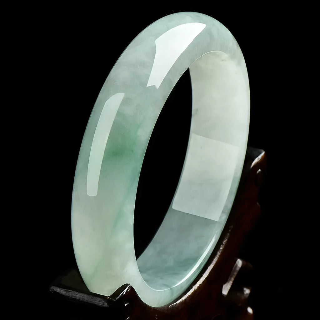Light green jade bracelet in natural style showing simple closed-loop design