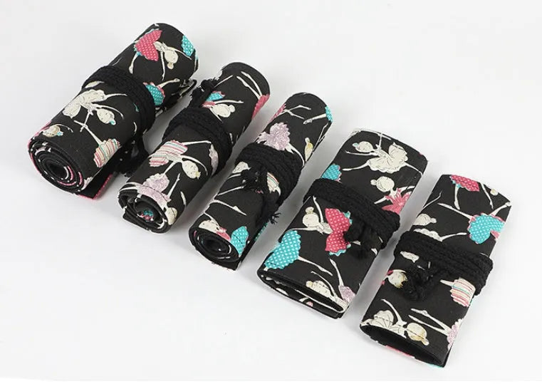 Canvas roll-up pencil case with ballet girl print, shown unrolled to display multiple pencil loops.