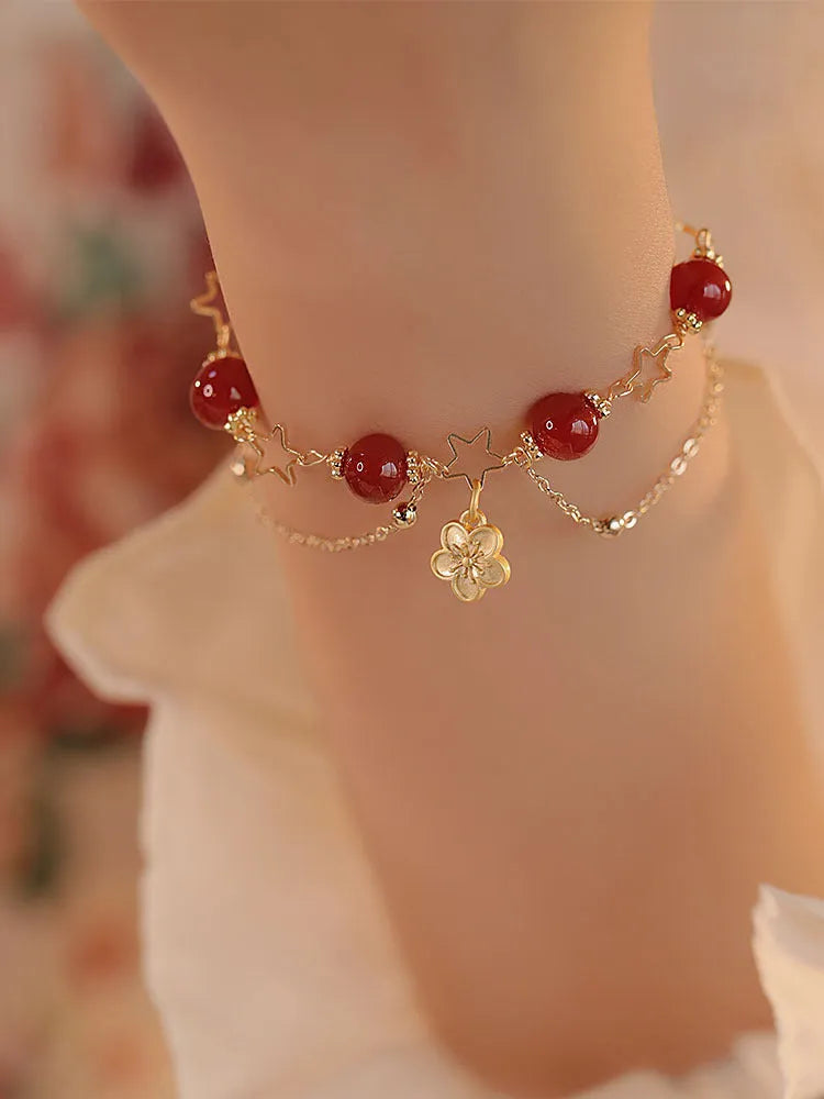 Red agate double layer bracelet for women with floral and peach blossom decorative elements.
