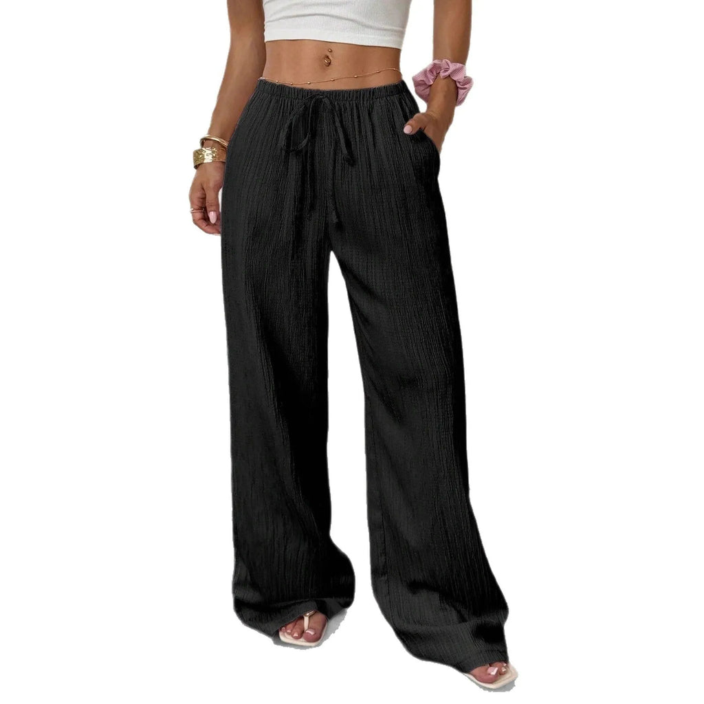 Women's black wide-leg trousers with lace-up waist trimming detail showing front view