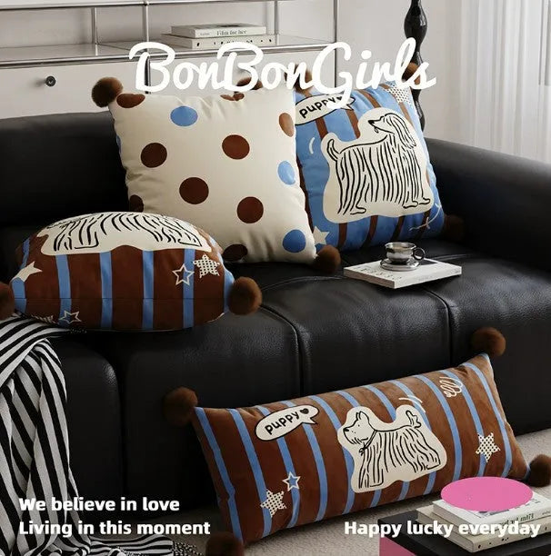 Blue cartoon animal print sofa cushion pillow with matching pillowcase on a grey sofa.