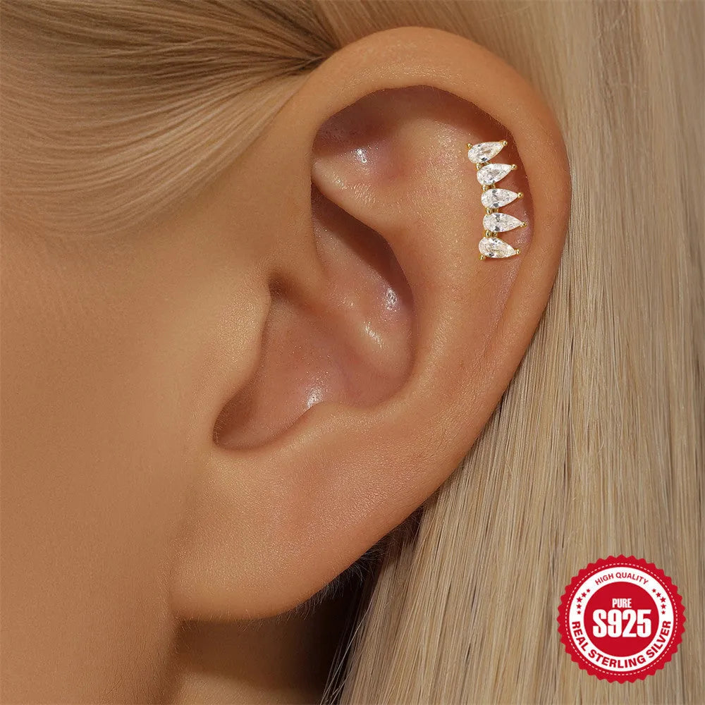 S925 sterling silver moon and star shaped earrings with embedded diamond details in a gold tone finish.