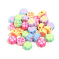 Assortment of frosted acrylic love clover beads in mixed colours on a white background.