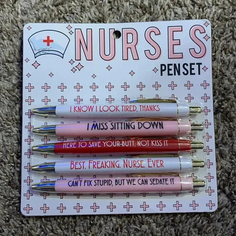 Set of five plastic nurse humour retractable ballpoint pens showing size.