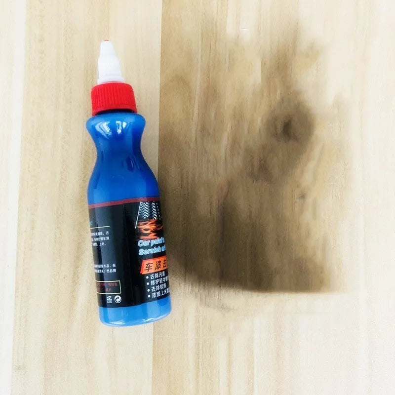 Blue car scratch repair cream bottle with applicator tool for automotive paint damage