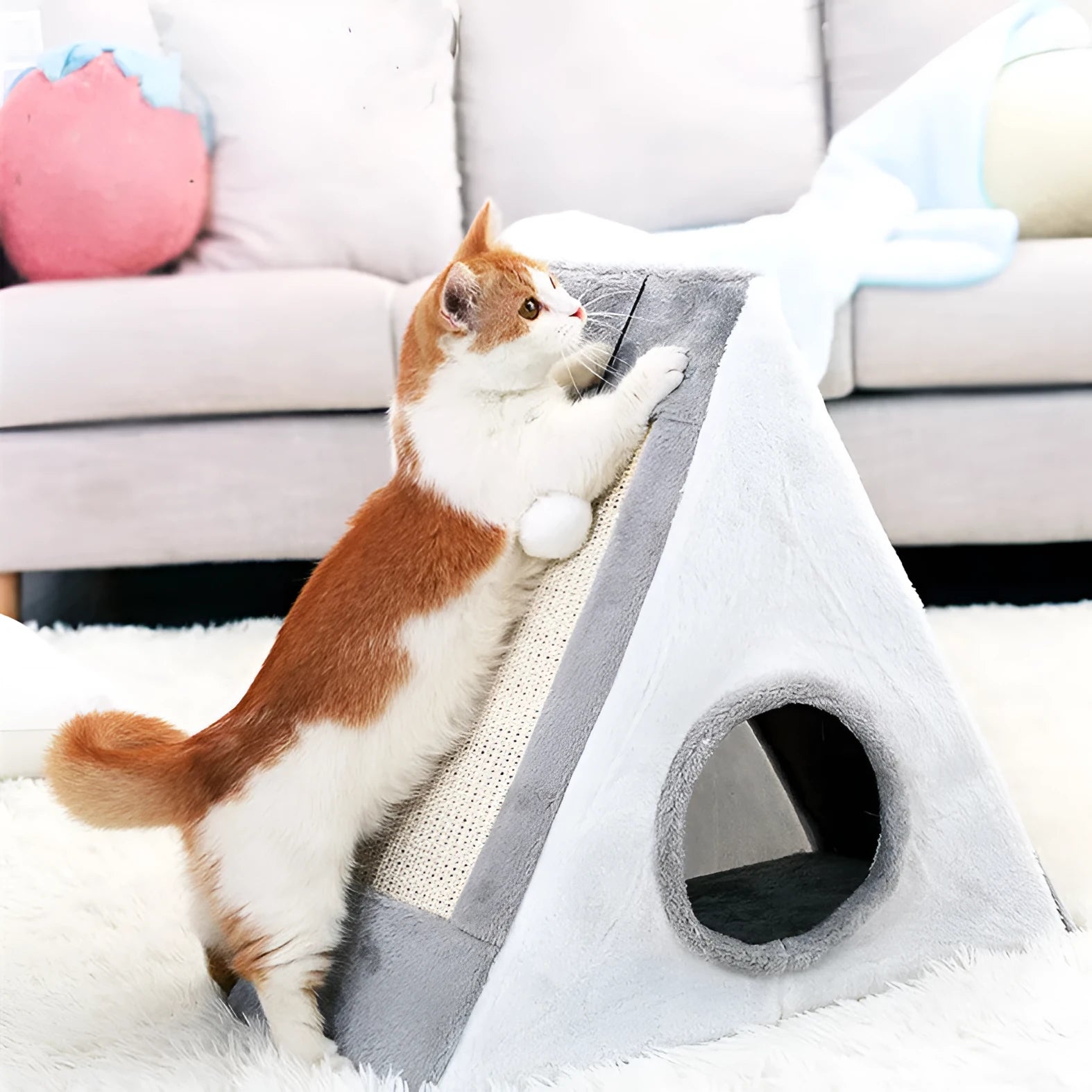 Triangular grey and white cat bed with integrated sisal scratching surfaces.
