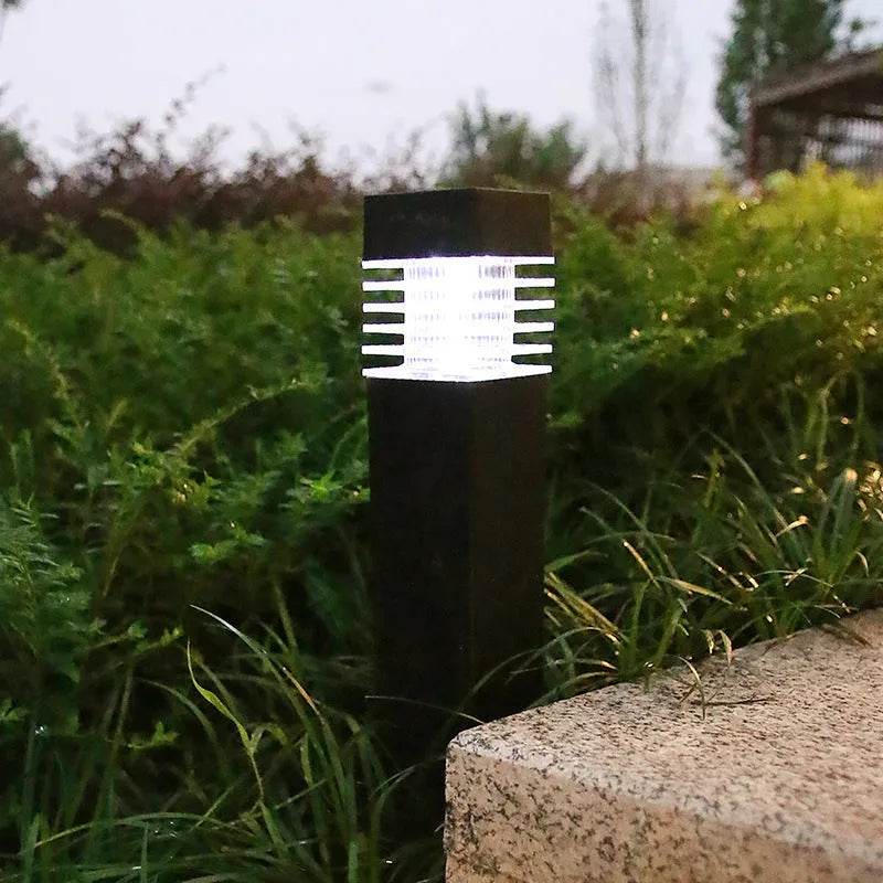 Solar lawn lamp with ground spike for garden lighting, showing cuboid shape and solar panel