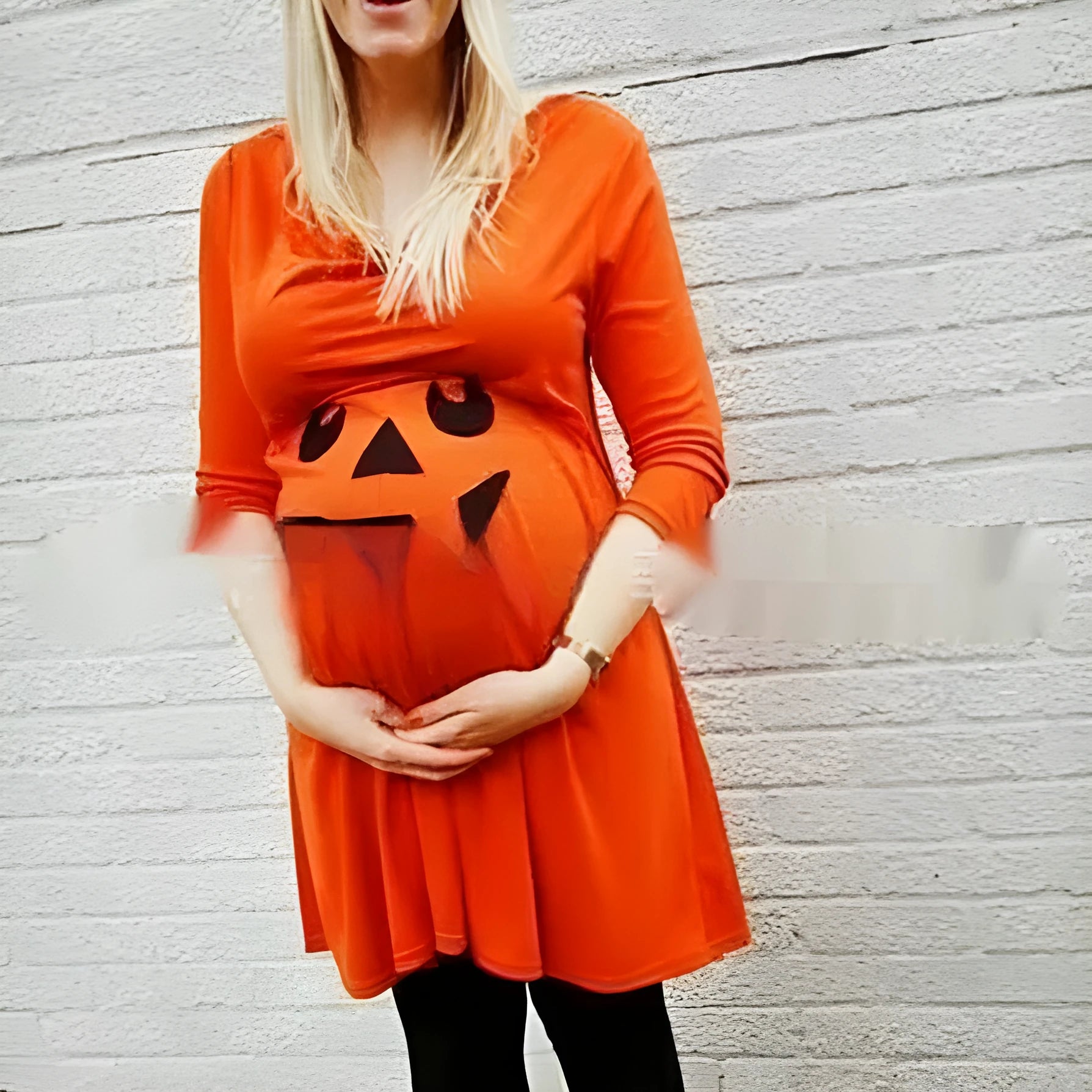 Orange cotton maternity dress for Halloween and seasonal wear, shown on hanger.