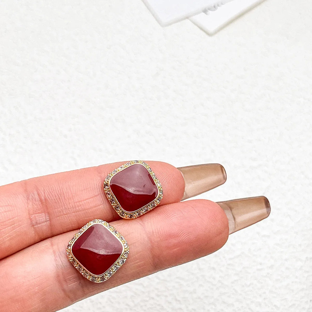 Red geometric alloy drop earrings with square detail for women.