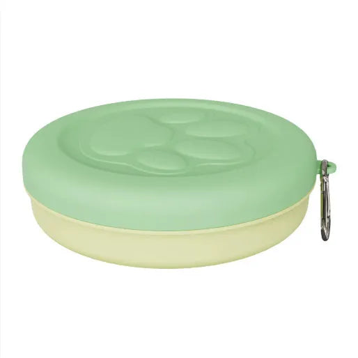 Green and pink portable plastic dog bowl with a snap-shut lid for travel