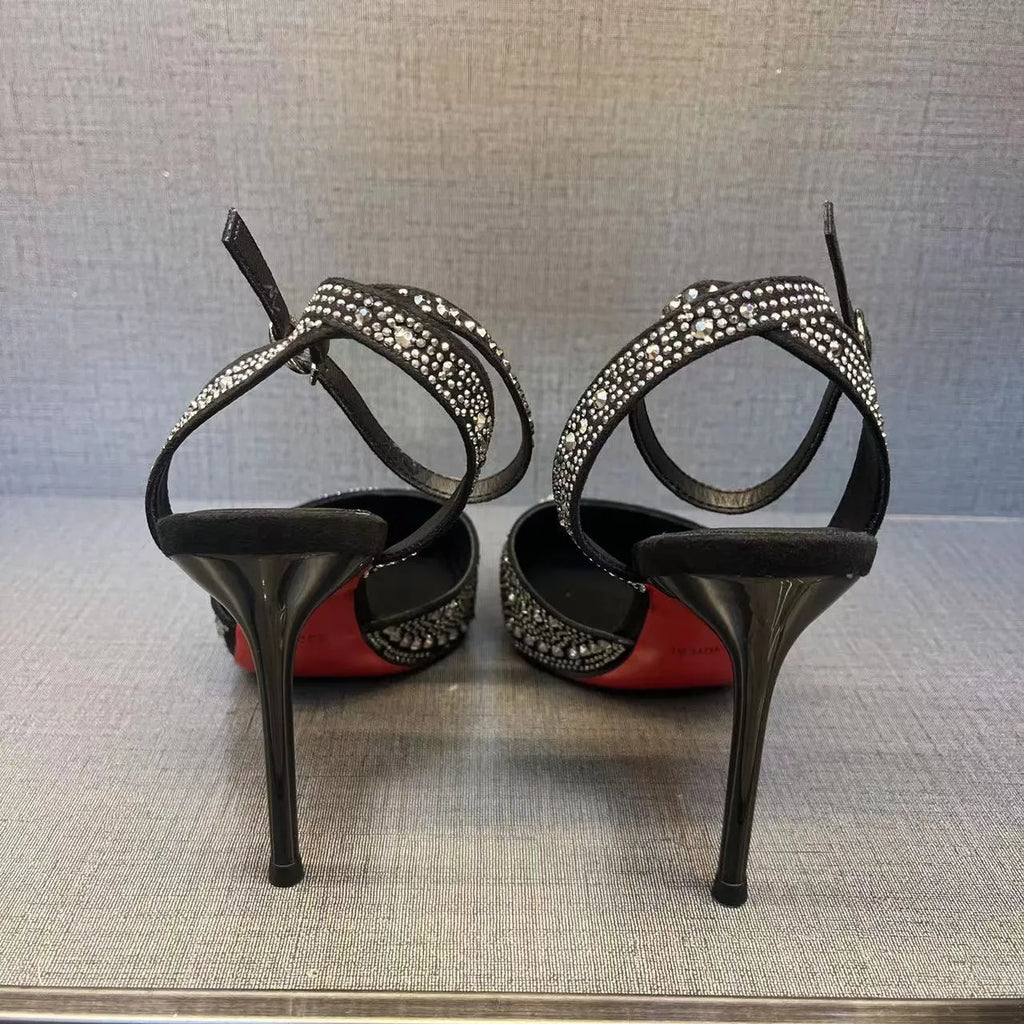Women's black hollow high heels with stiletto heel, pointed toe, and red sole
