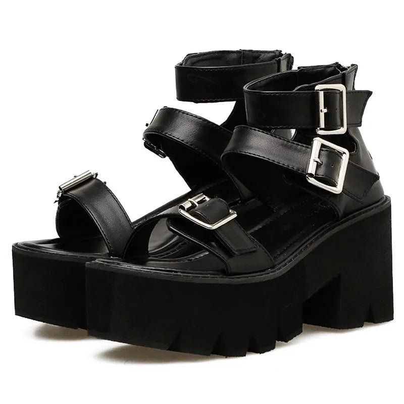 Black women's sandals with chunky heel, thick sole, round toe, buckle detail, and back zipper.
