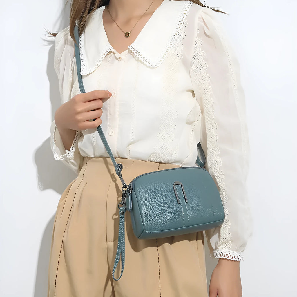 Genuine leather women's square shoulder bag in black, shown with dimensions 19cm by 13cm by 6cm.
