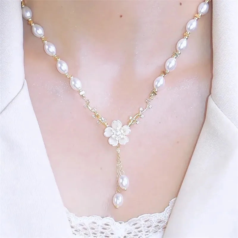 Alloy fashion necklace with pearl flower design and rose floral elements on pearl chain