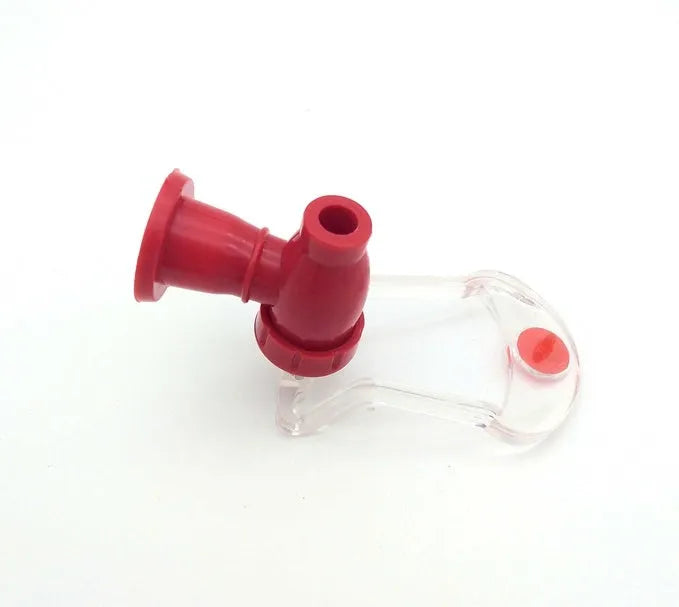Red plastic Magic Tap soda bottle dispenser attached to a 2-litre drink bottle