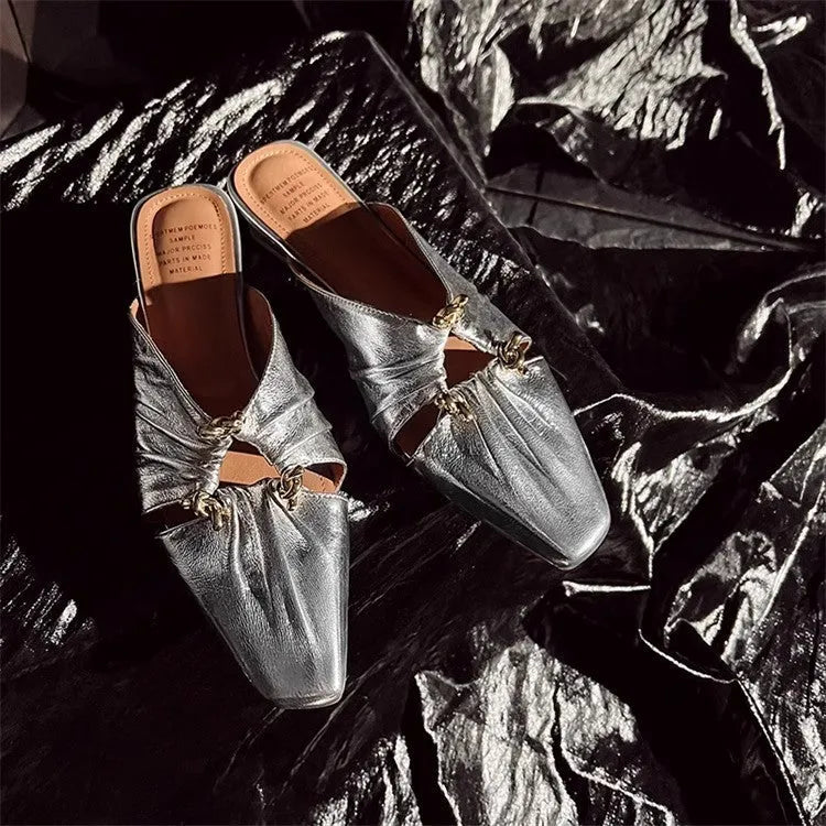 Women's genuine leather half toe cap slippers in gold colour with a low heel and square toe.
