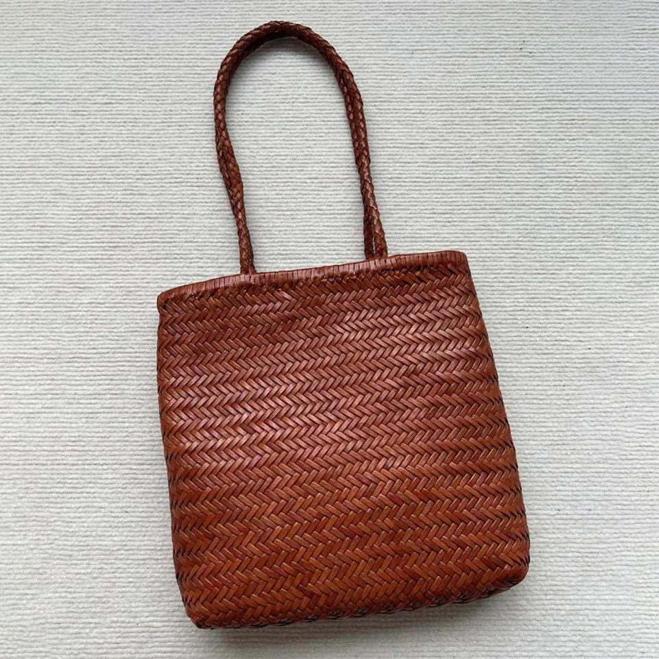 Brown woven leather tote bag with three-dimensional pockets measuring 27cm high by 30cm wide