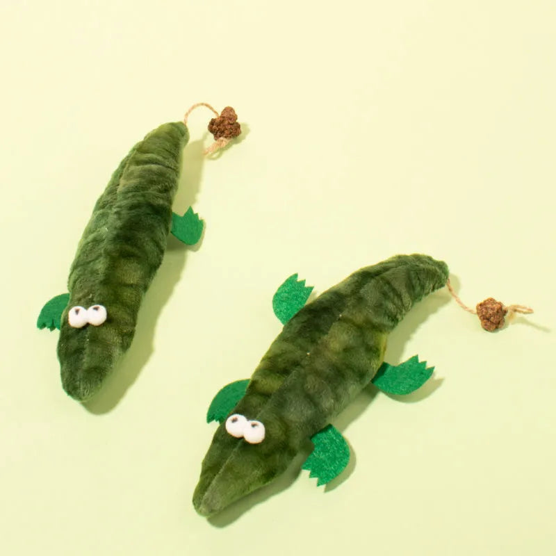 Green plush alligator cat toy measuring 28cm long with textured surface for feline play
