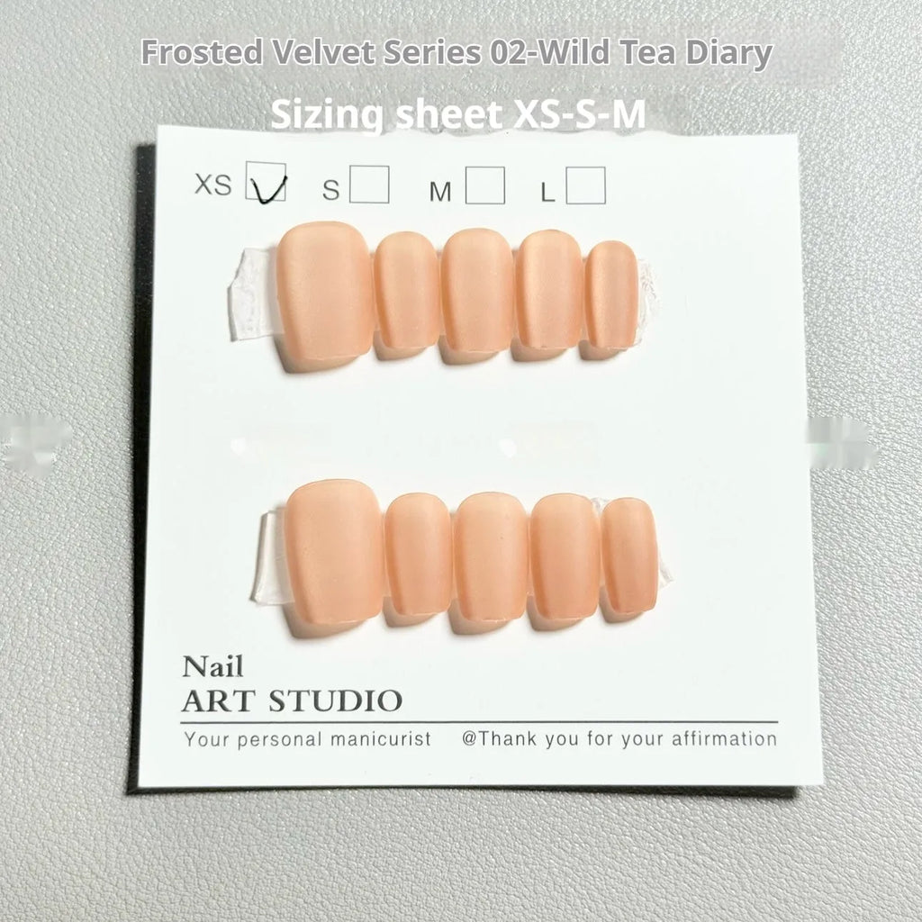 Set of velvet frosted false nails in short ladder shapes showing Cat's Eye, Aurora, and solid colour designs.