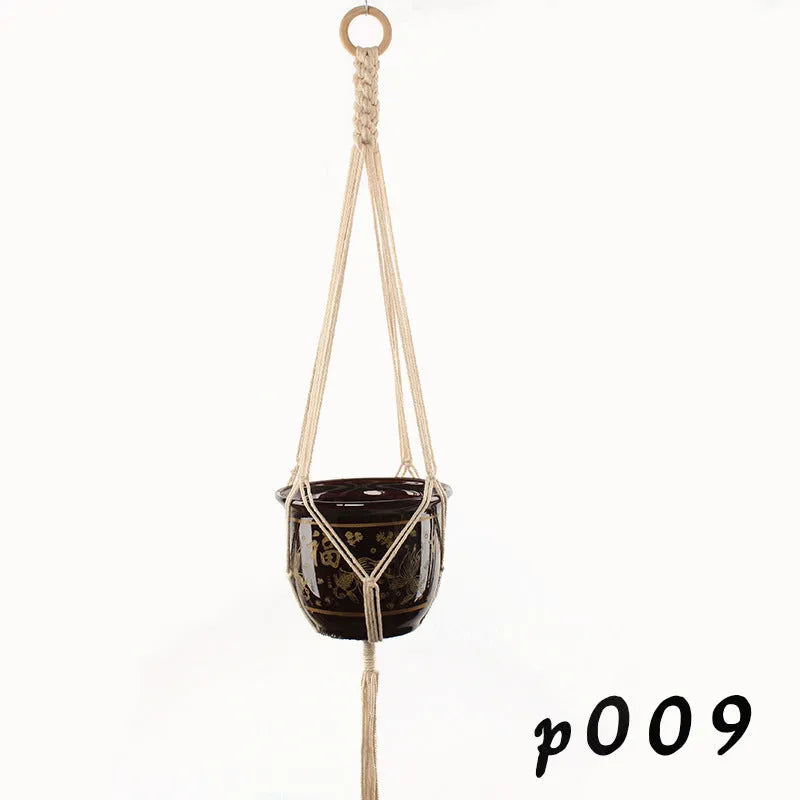 Woven wire cotton rope rustic hanging basket plant holder on a wall.