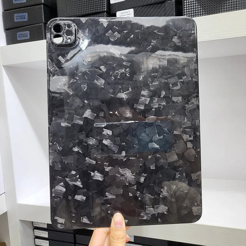 Apple iPad Pro 11 hard case made of black carbon fibre with an embossed plaid pattern.