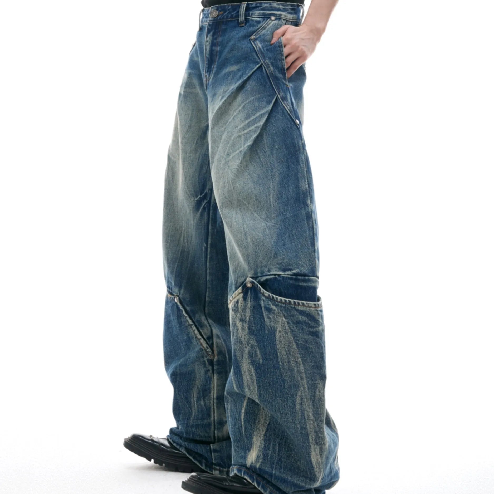 Men's verdant blue retro washed loose fit jeans with burst pattern and curved knife detail.