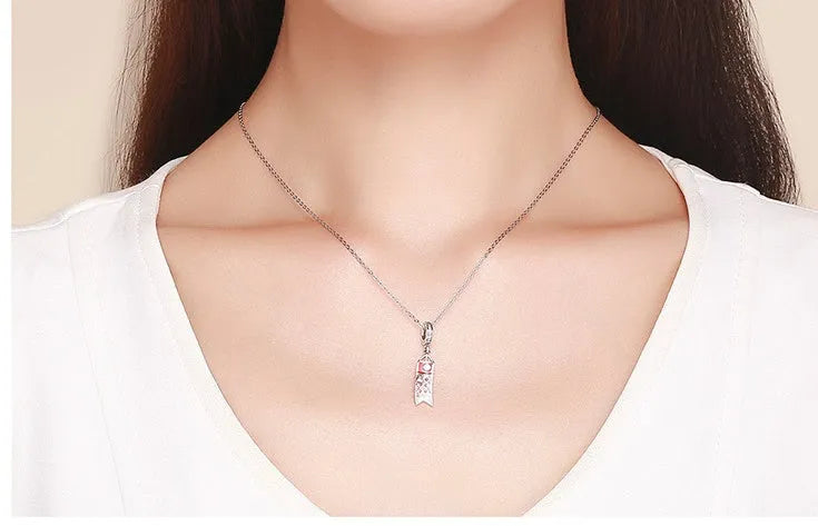 S925 sterling silver carp streamer pendant charm with zircon details on a white background