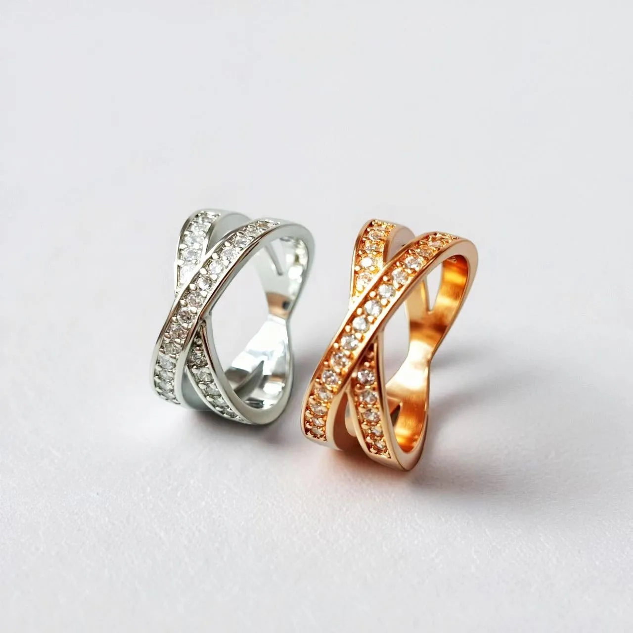 Geometric heart-shaped cross ring with micro-inlaid zircon details on a copper band.