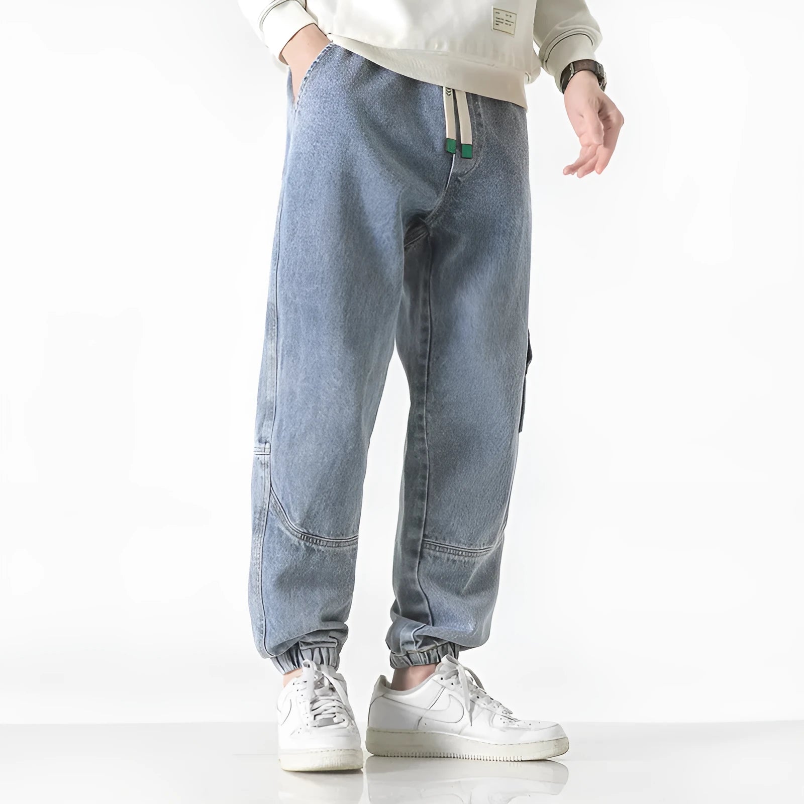 Men's loose-fit tapered cotton trousers in black, blue, or grey colours with mid waist design