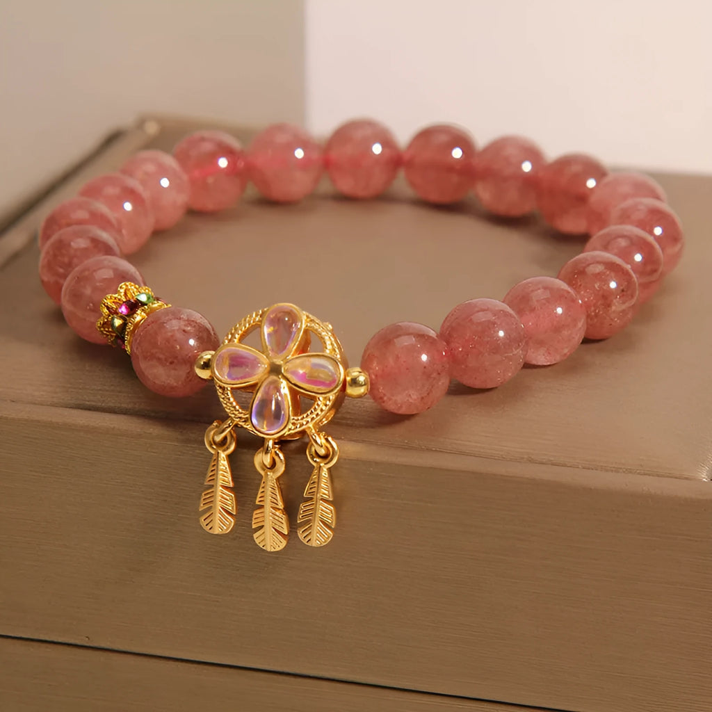 Women's strawberry quartz crystal bracelet with four-leaf dream catcher ball pendant
