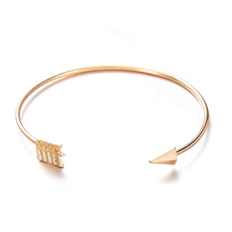Gold electroplated women's vintage cuff bracelet with arrow knot detail