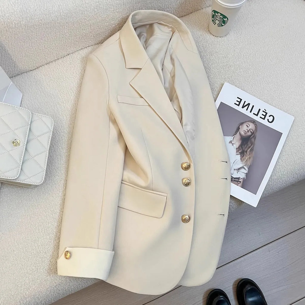Korean-style loose fit women's trench coat in milky white with long sleeves and pockets.