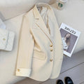 Korean-style loose fit women's trench coat in milky white with long sleeves and pockets.