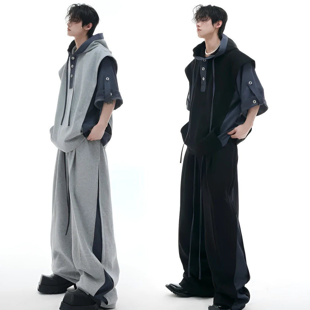 Men's black heavy industry sports suit with hooded short sleeve jacket and trousers laid flat.