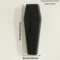 Black wooden cross wall shelf decoration measuring 27 cm by 9 cm.