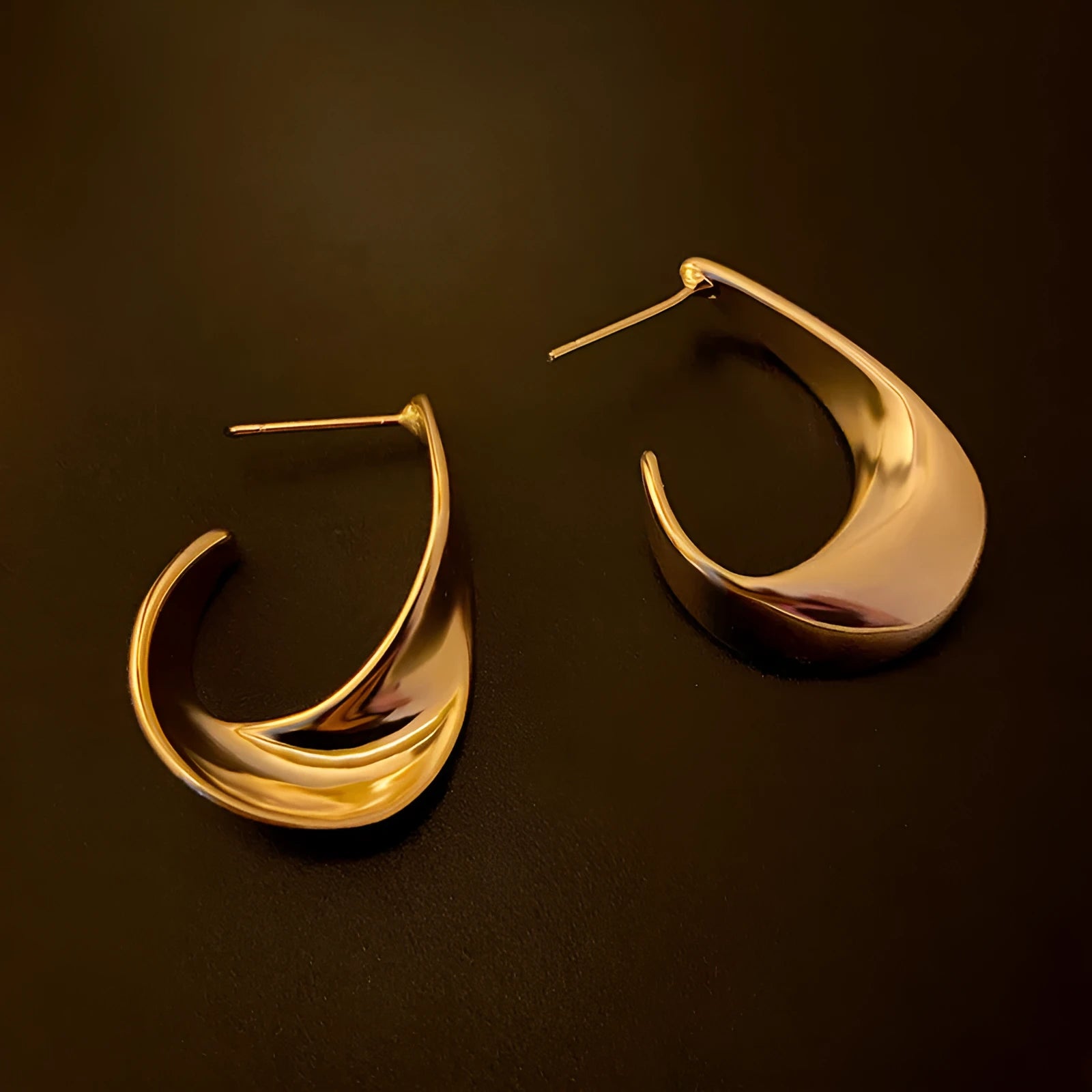 Twisted geometric metal earrings with gold or silver electroplated finish