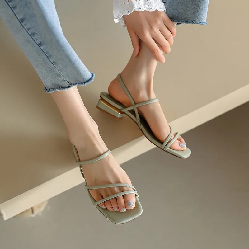Women's flat strap Roman sandals with square toe in microfiber, shown in green colour