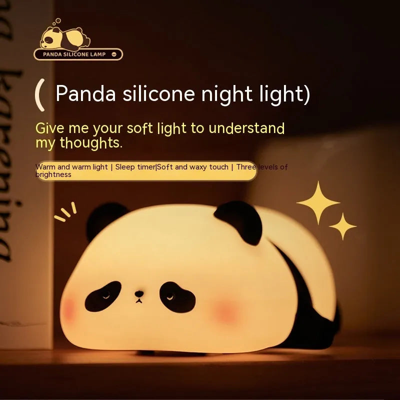 Cartoon panda-shaped night light with soft white glow on dark surface