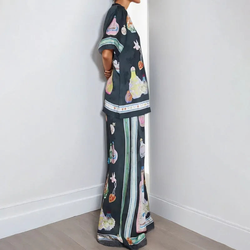 Black women's casual set with cartoon animation print showing cardigan top and matching trousers