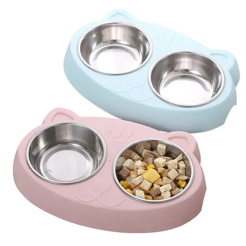 Blue plastic double bowl pet feeder tray for cats and small dogs on a floor.