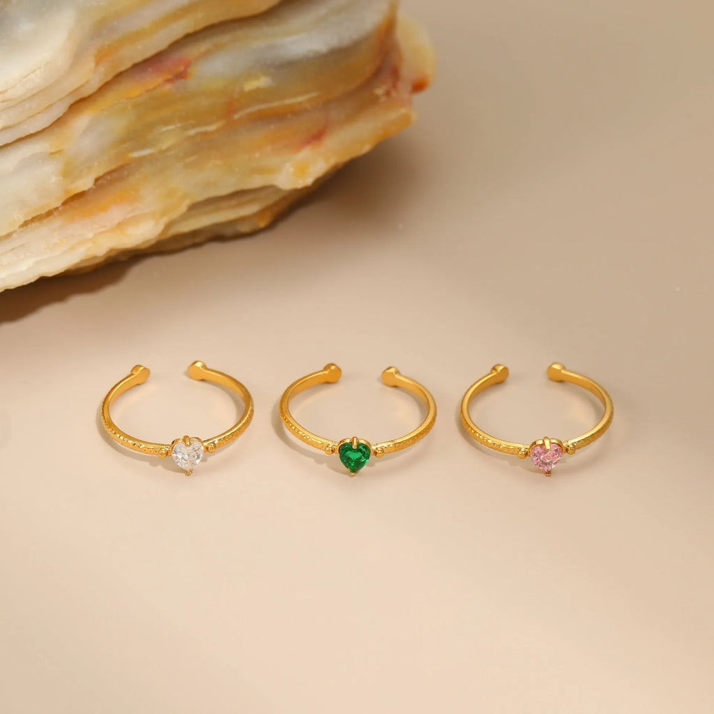 Adjustable open-ended stainless steel ring with heart-shaped zircon design in three colour options