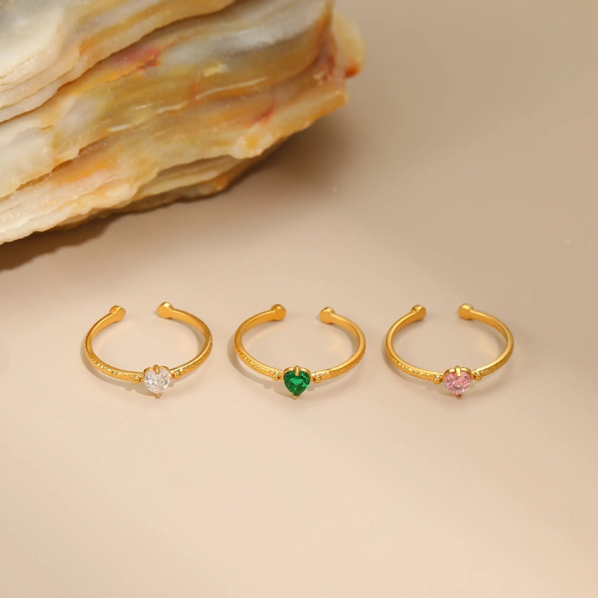 Adjustable open-ended stainless steel ring with heart-shaped zircon design in three colour options
