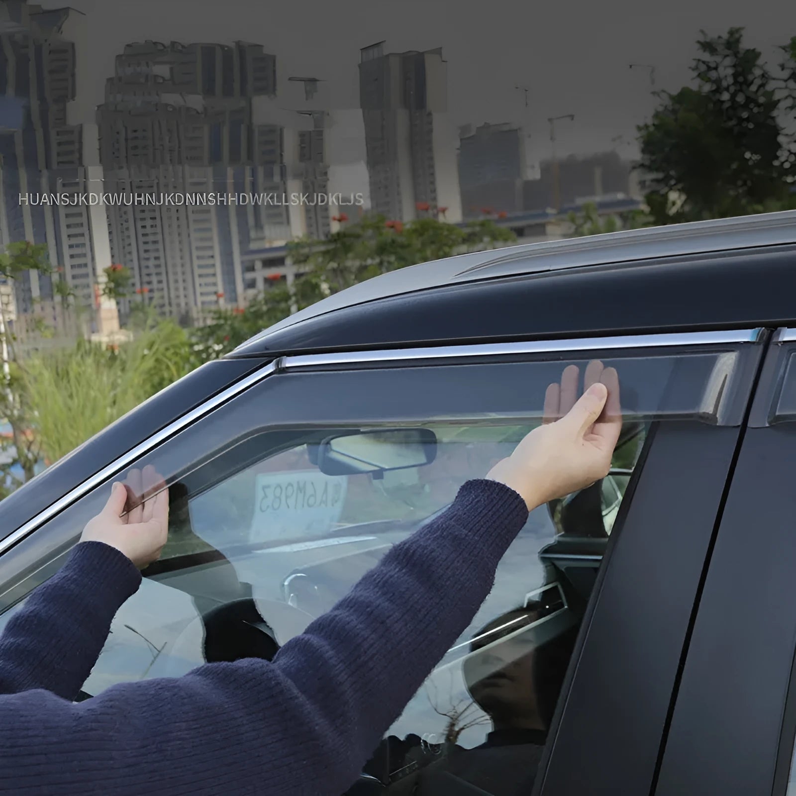 Mitsubishi Outlander window deflectors in black engineering plastic installed on vehicle windows