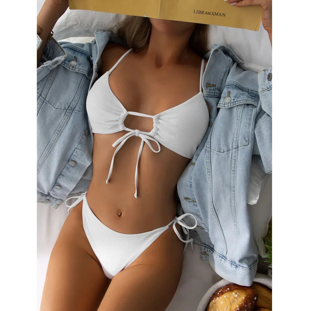 Women's solid colour drawstring bikini set on a mannequin, showing bra and briefs style.