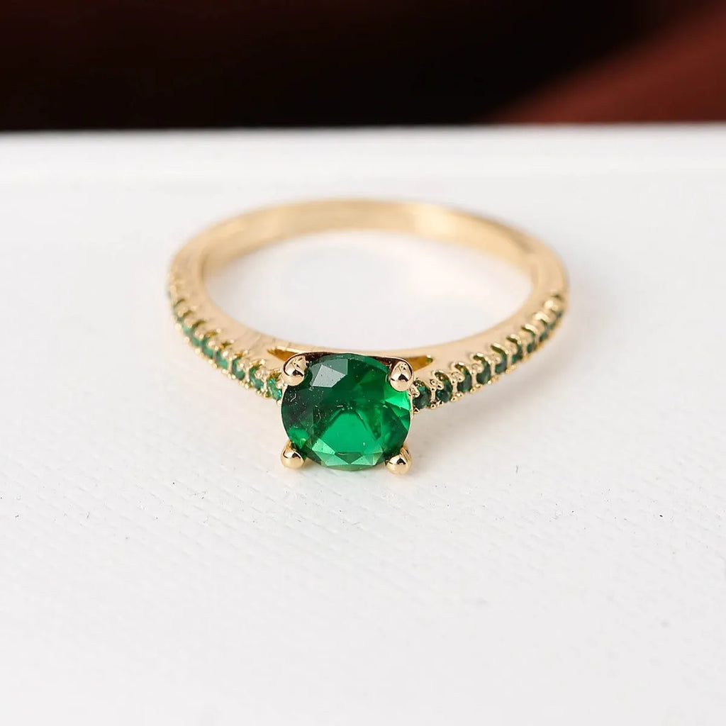 Copper hexagon geometric ring in electroplated gold rose red colour on a size 8 finger.