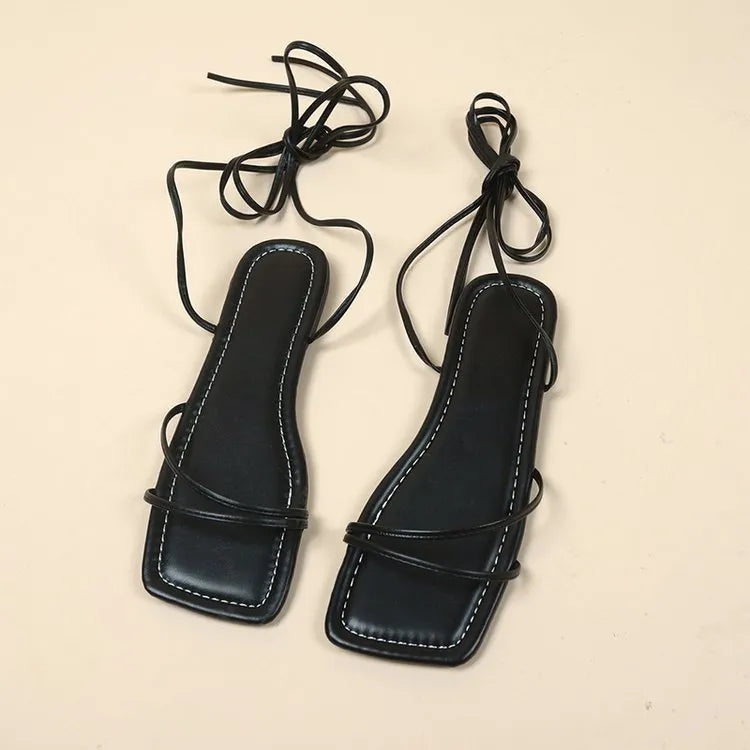 Women's flat sandals with white ankle bandage wrap, square toe, and lace-up front.