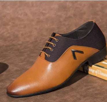 Men's black Oxford shoes with a rubber sole on a white background.
