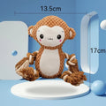 Plush lion and monkey squeaky dog toys side by side on a neutral background.